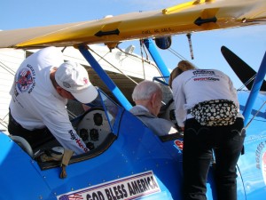 Ageless Aviation Dreams Foundation volunteers, Pilot Mike Winterboer, and his wife, Diane, prepare a passenger for flight.